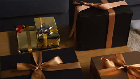 Close-Up-Of-Gift-Wrapped-Presents-On-Table-In-Lounge-At-Home-8